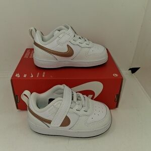 Nike Kids White Sneakers with Metallic Bronze Swoosh